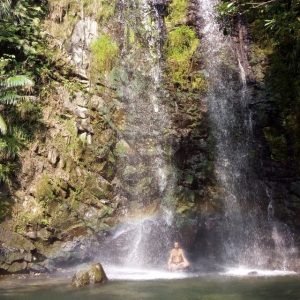 Meditating at the bottom of a waterfall