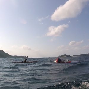 2 kayaks making an open sea crossing in the Kerama's
